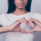 Girl making heart shape with her hands